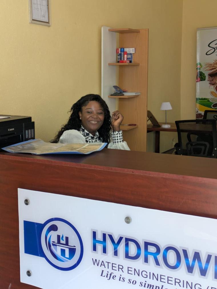 A member of the Hydrowell team welcoming clients at the front office in Harare